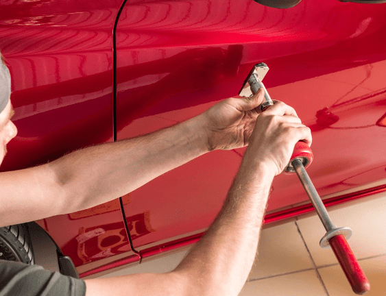 How to fix a small dent in a car using a dent-pulling kit